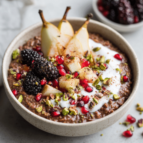 Chocolate Overnight Oats with Poached Pear, Pomegranate & Pistachios