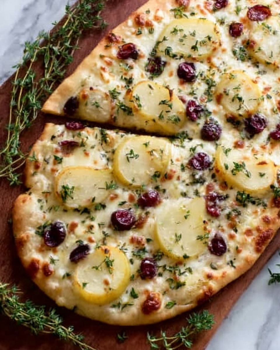The image shows a flatbread pizza on a wooden board with a thin golden-brown crust. The pizza has three main layers: the base layer is a light melted cheese that covers the whole crust, the second layer has thin slices of green pear placed evenly, and the top layer includes scattered red cranberries, chopped nuts, and small green herb sprigs. The toppings are spread enough to cover most of the flatbread but still show the cheese and crust underneath. The background is a white marbled texture. photo taken with an iphone --ar 4:5 --v 7