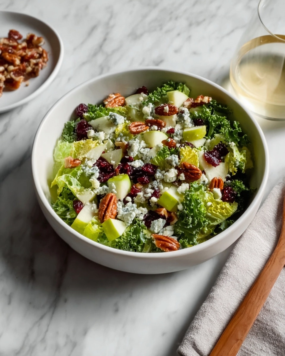 Large white serving bowl brimming with a vibrant mixed green salad featuring crisp romaine lettuce, crunchy walnut pieces, tart dried cranberries, thinly sliced green apple, and crumbles of creamy blue cheese, all lightly tossed to showcase each ingredient vividly. The salad is beautifully arranged and presented on a white marble countertop, styled naturally with soft, natural lighting that highlights the freshness of the ingredients. Professional overhead shot with the entire bowl in frame, evoking a fresh and wholesome feel, photo taken with an iphone --ar 4:5 --v 7
