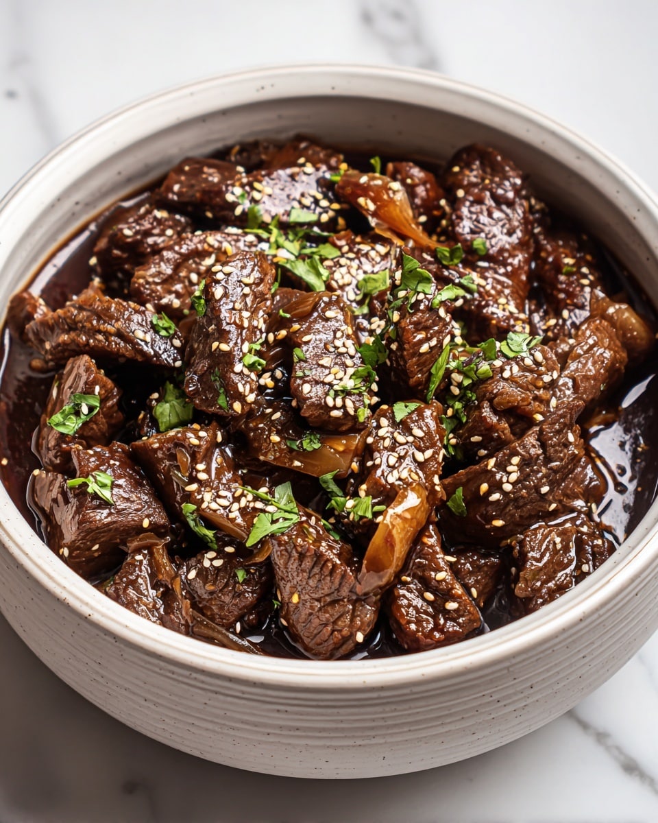 Large white ceramic serving bowl filled with tender braised beef chunks in a rich, glossy dark soy and garlic sauce, garnished generously with toasted sesame seeds and fresh chopped cilantro, the whole dish showcasing a hearty, comforting presentation. Photographed from a professional 3/4 angle on a white marble countertop with natural lighting, styled like a hero shot from a food magazine, photo taken with an iphone --ar 4:5 --v 7
