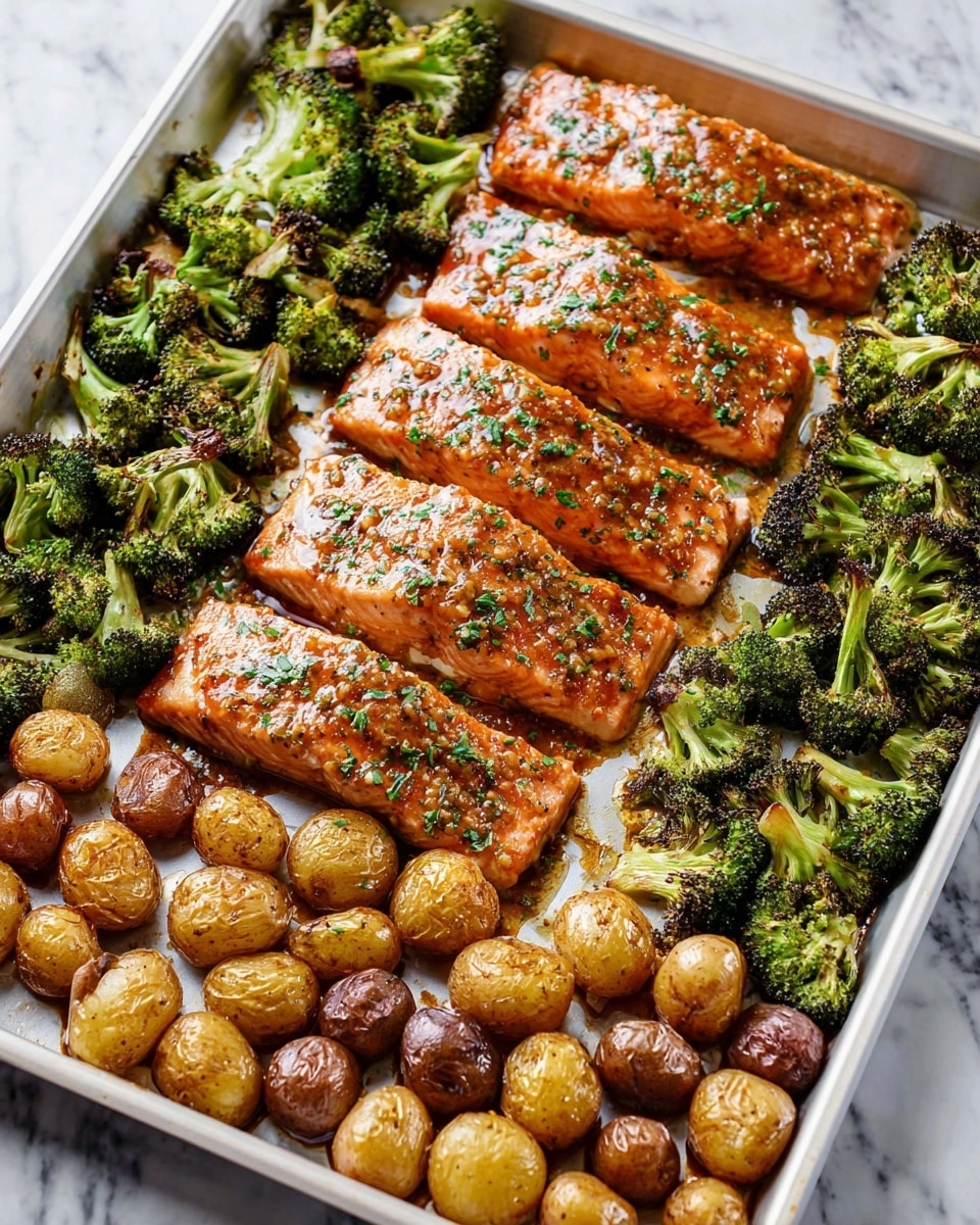 Large white rectangular baking tray filled with a complete sheet of perfectly roasted salmon fillets, each glazed with a shiny, richly seasoned honey mustard sauce and sprinkled with fresh chopped herbs, surrounded by rows of golden-brown roasted baby potatoes and vibrant charred broccoli florets, all arranged neatly in rows, photographed from a 3/4 angle on a white marble countertop under natural lighting, professional food styling, photo taken with an iphone --ar 4:5 --v 7