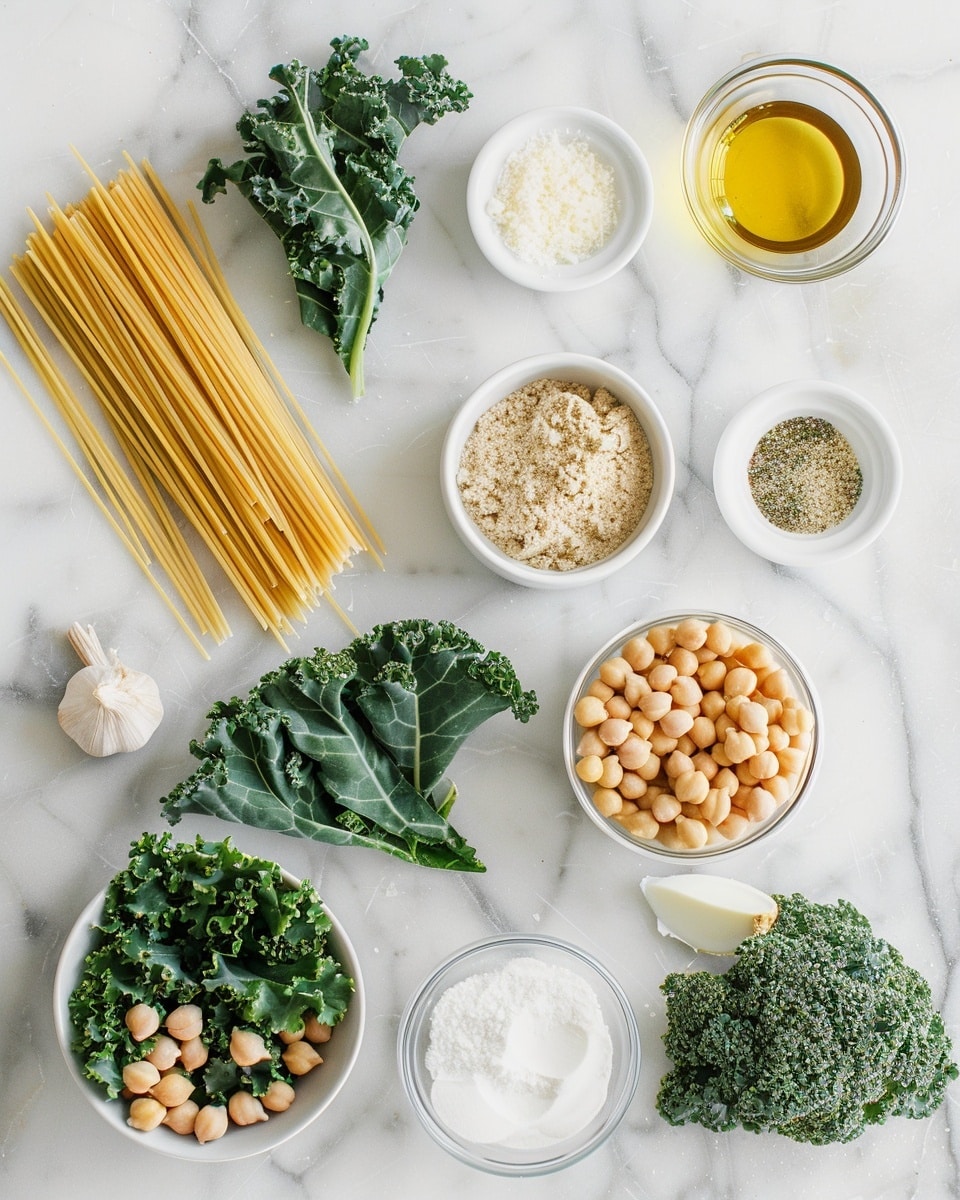 Single white bowl featuring a close-up view of a single serving of creamy kale pasta salad with spiraled rotini pasta, roasted chickpeas scattered on top, and fresh shaved parmesan cheese, showcasing the vibrant green kale leaves coated in a light creamy dressing, all elegantly plated with natural lighting on a white marble background, styled like a food blog photo taken with an iphone --ar 4:5 --v 7