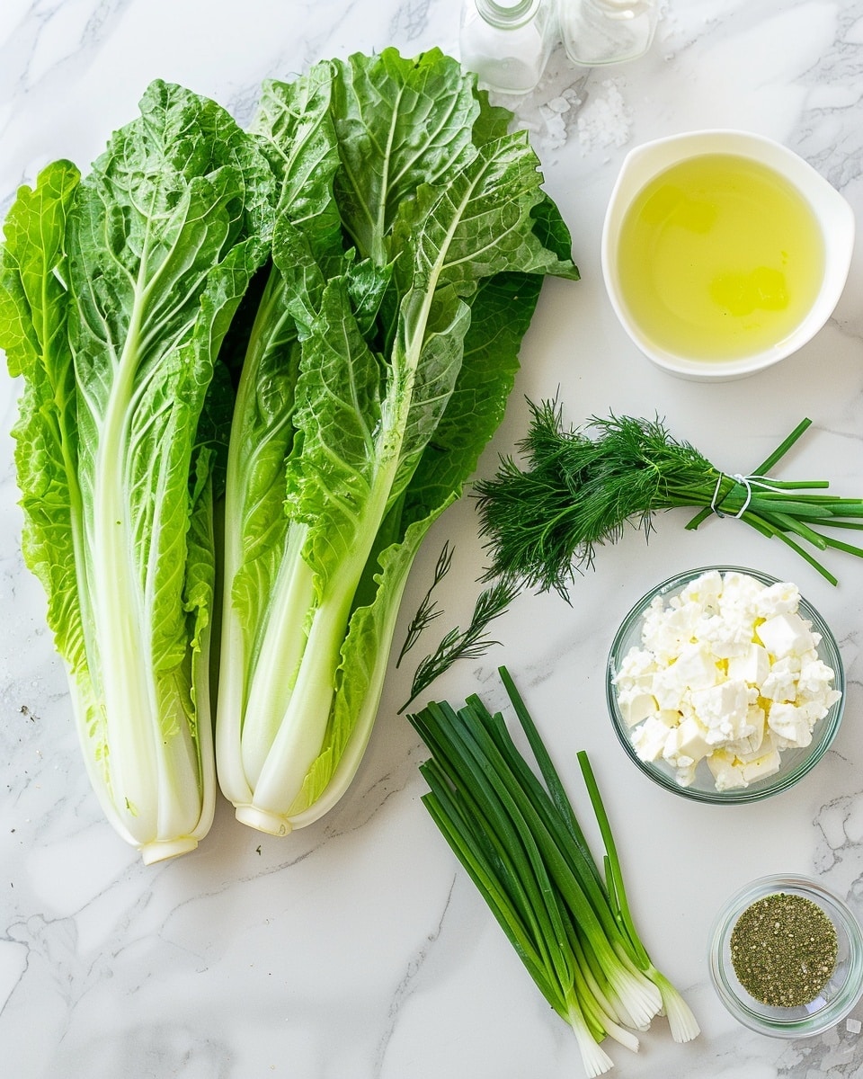 Single white plate with a fresh serving of finely shredded green lettuce mixed with crumbled feta cheese and delicate dill herbs, close-up angle emphasizing the vibrant green textures and crumbly cheese bits, natural lighting highlighting the freshness and lightness of the salad, set on a white marble surface with hints of a linen cloth in the background, styled as a ready-to-eat portion from a food blog, photo taken with an iphone --ar 4:5 --v 7