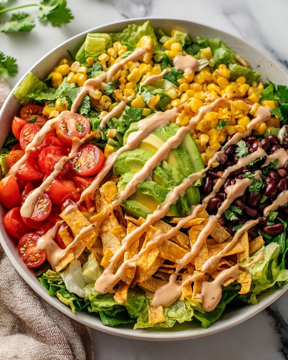 Large white serving bowl filled with a vibrant southwestern salad featuring fresh green romaine lettuce, halved cherry tomatoes, black beans, and yellow corn kernels, topped with slices of ripe avocado and golden crispy tortilla strips, drizzled with creamy chipotle dressing, garnished with fresh cilantro leaves, photographed from a 3/4 angle on a white marble countertop with natural lighting, professional food magazine hero shot photo taken with an iphone --ar 4:5 --v 7