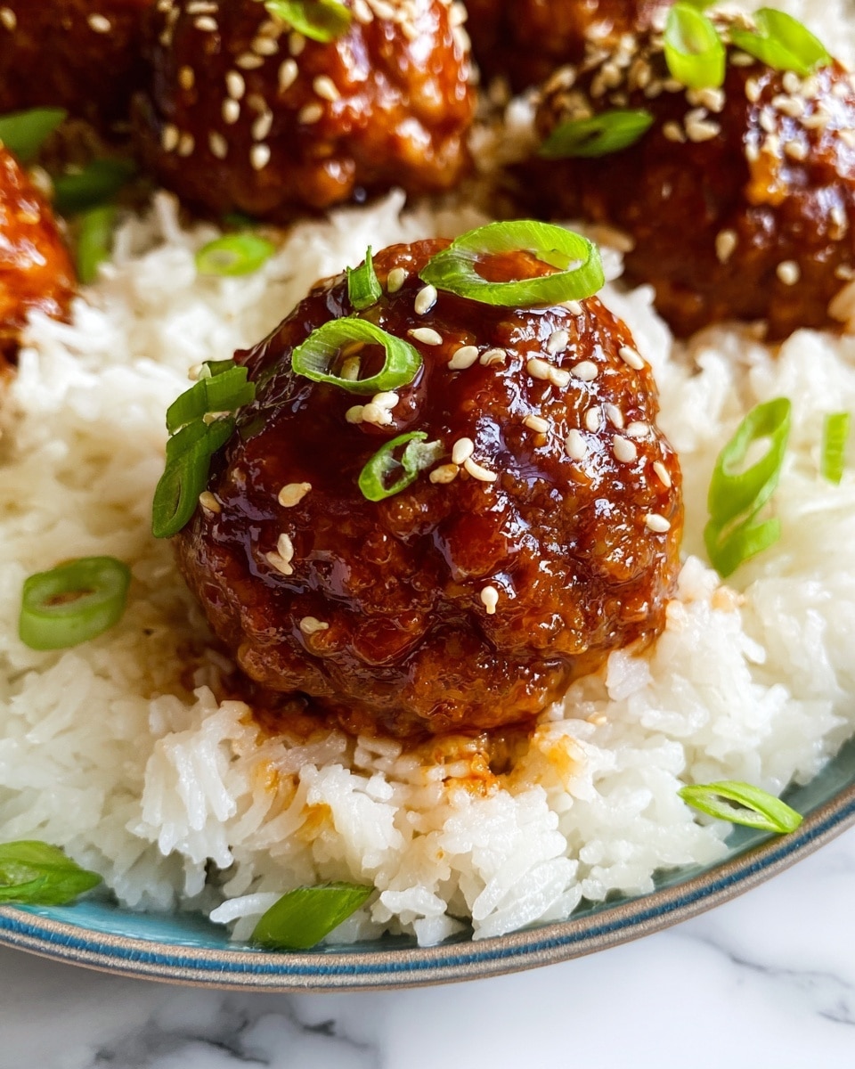 Large white skillet filled with a complete batch of glossy, saucy meatballs generously coated in a rich, dark teriyaki-style glaze, each meatball topped with a sprinkling of white sesame seeds and finely chopped fresh green onions, whole dish shown from a professional 3/4 angle on a white marble background under natural lighting, styled like a high-end food magazine hero shot, photo taken with an iphone --ar 4:5 --v 7