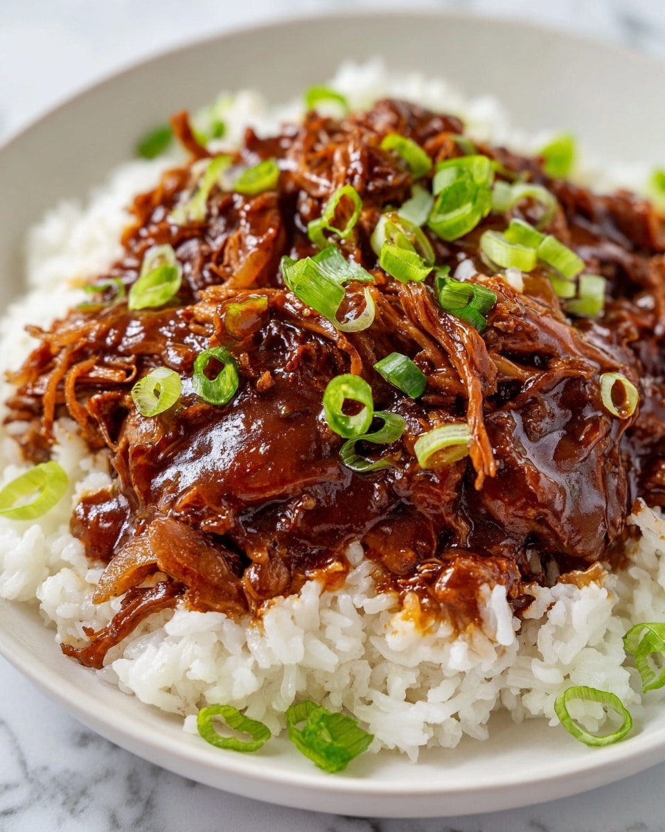 Large white serving bowl filled with a whole portion of savory soy-glazed chicken thighs glazed in a rich, glossy dark sauce, topped generously with thinly sliced fresh green onions, all nestled over a bed of fluffy white rice, presented in a single, impressive dish photographed from a professional 3/4 angle on a white marble countertop with natural lighting, styled like a hero shot from a food magazine, photo taken with an iphone --ar 4:5 --v 7